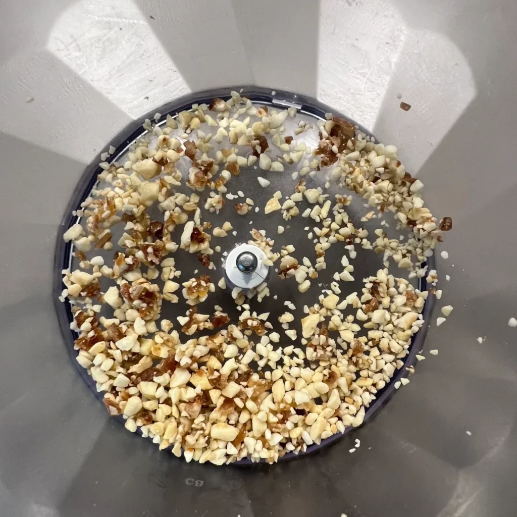 Leftover crumbled nuts in a food processor.